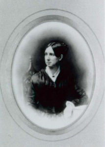 Photo portrait of Dorothea Dix: seated, dark hair parted in the center, framed in oval matt