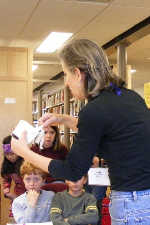 Archivist shows documents to 5th graders