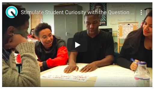 Students talking around a table