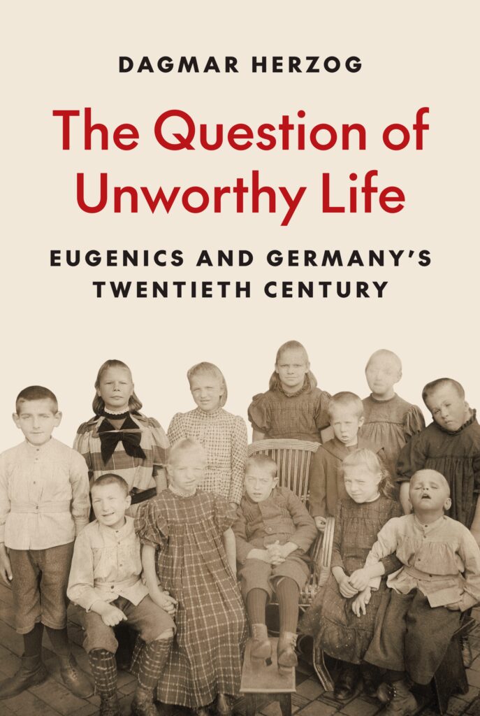 Cover of Dagmar Herzog's book: The Question of Unworthy Life: Eugenics and Germany's Twentieth Century. A photo shows a dozen children, some using wheelchairs; all are white and dressed in early 20th century long dresses or knickers. 
