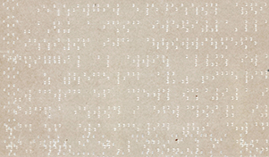 Braile writing - a cream piece of paper with rows of lighter colored dots in dense patterned groups. 