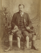 John W. January, veteran of Co. B, 14th Illinois Cavalry Regiment, with prosthetic legs