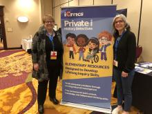 ""Laurie Risler and Kelley Brown, two middle-aged women wearing glasses and smiling, pose next to a large sign for iCivics Private i History Detectives""