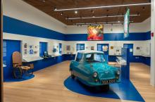 Museum of Disability History interior, exhibits include an accessible car and other images and items