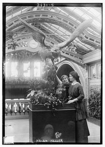 Helen Keller (1880-1968) with her teacher Anne Sullivan Macy (1866-1936) possibly at the International Flower Show, New York City, April 1913.
