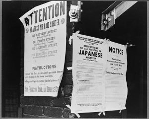 Two posters (image in black and white) stating "Attention" and "Instructions to all persons of Japanese ancestry"