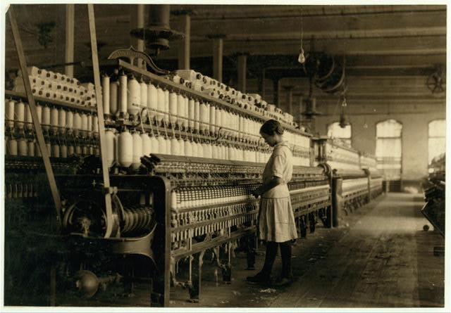 Fourteen year old spinner in a Cotton Mill 