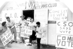 Chicano farmworkers with voting registration papers