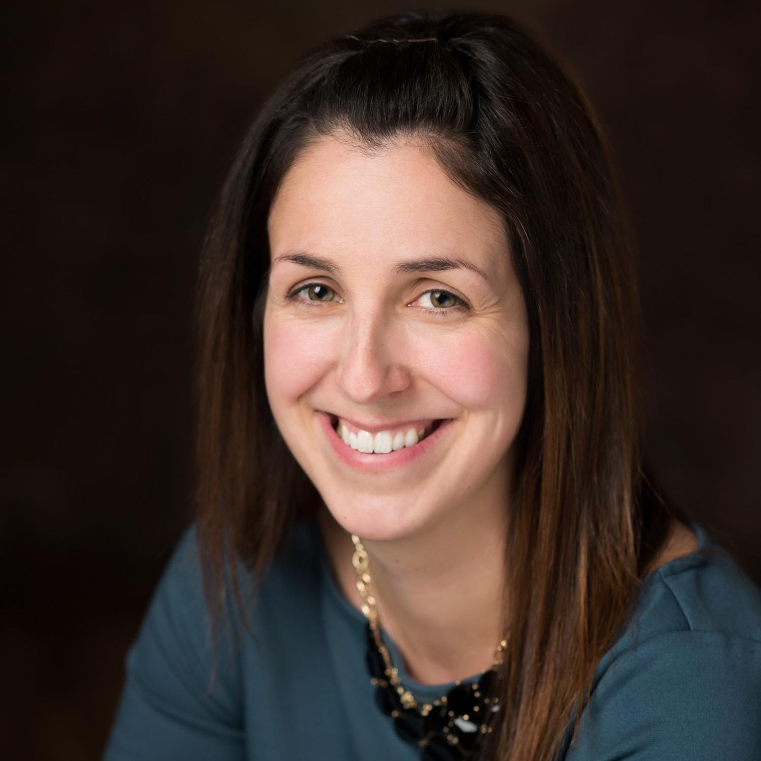 Karen Albano Image - a smiling white woman with shoulder length hair