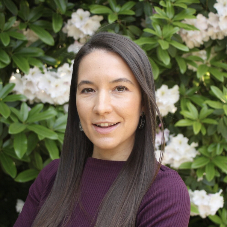 Head shot of Leah Bueso, woman with dark hair. 