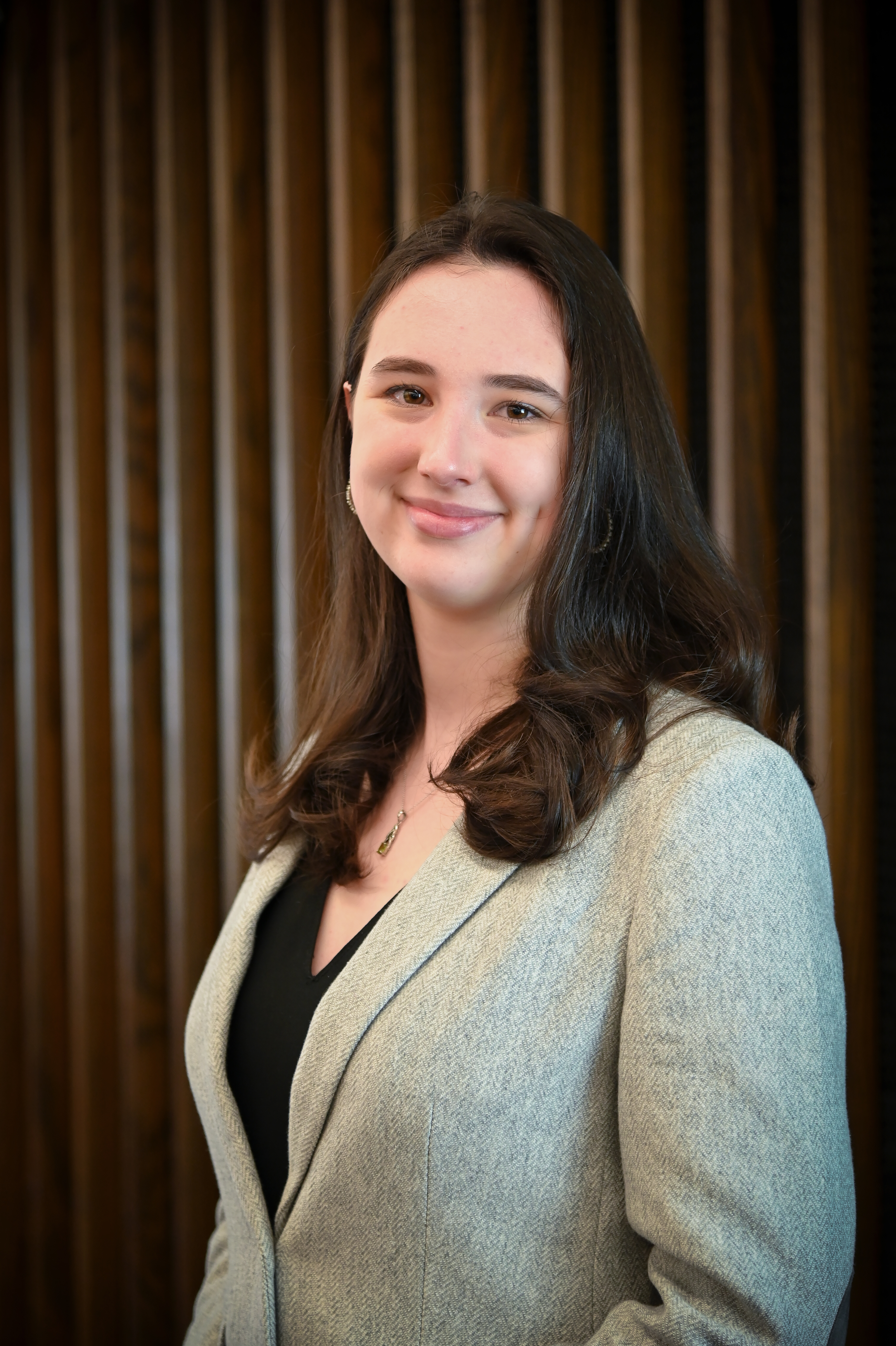 Photo portrait of a white woman with shoulder length hair. 