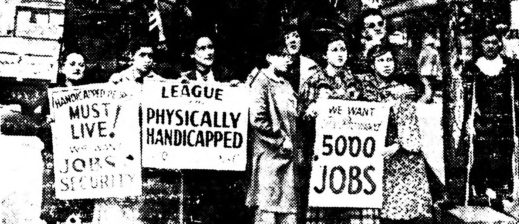 Protesters carry signs for the League of the Physically Handicapped.