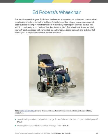 A screenshot from a book featuring a large image of an old blue electric wheelchair. On the side of the wheelchair, there is a sticker that reads “yes!” 