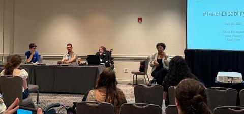 Presenters sit behind a table at the National Council for Independent Living Conference