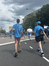 Activists in matching blue t-shirts march in Washington